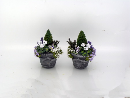 White Geraniums, Conifer, Perriwinkles and Rockery